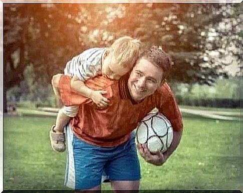 Father carrying the baby on his back