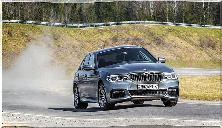 alt = "BMW 5 Series on track"