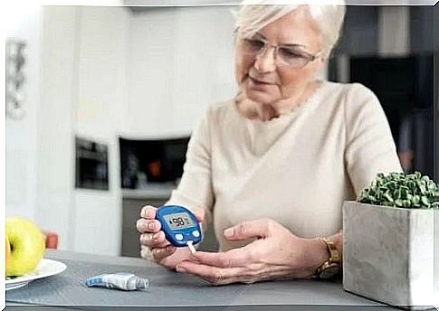 Woman measuring her blood sugar