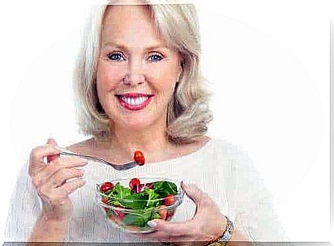 Woman serving a healthy salad