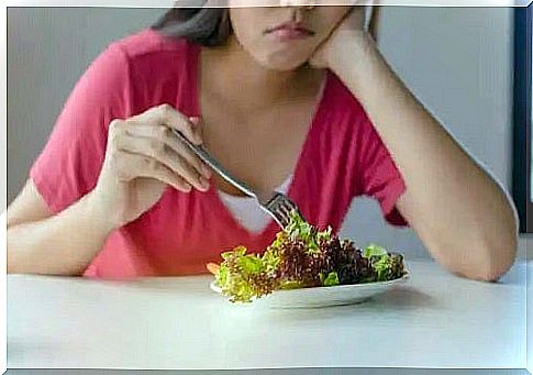 Woman eating salad