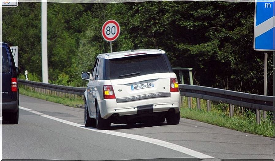 Car driving on the shoulder.