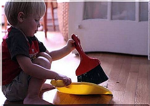 Boy with dustpan and dustpan