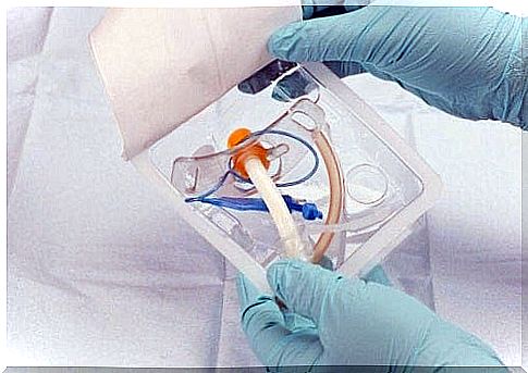 Doctor preparing a sterile endotracheal tube