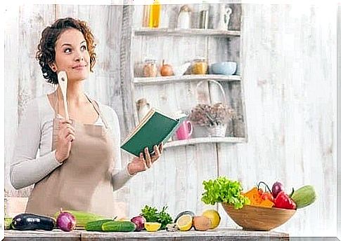 Woman reading tips to adopt vegan diet